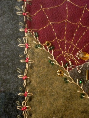 Original crazy quilt crafted by Angela McInnis & used in A Stitch in Crime's cover. 